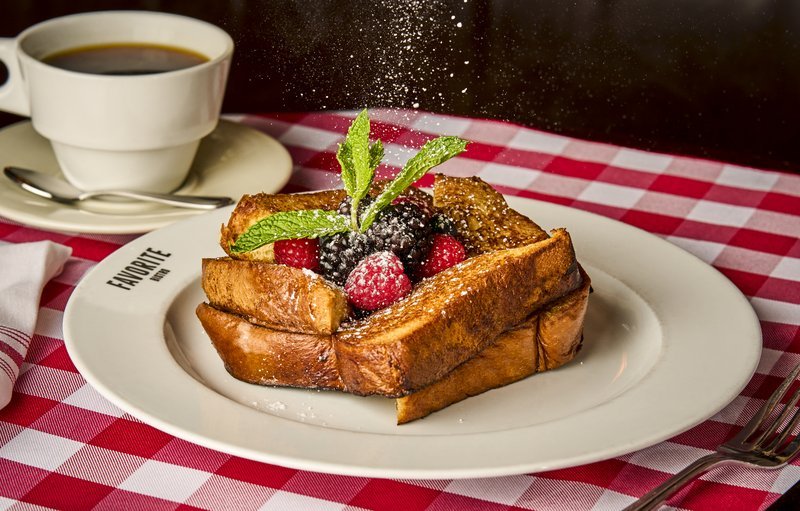 French toast with berries and powdered sugar.