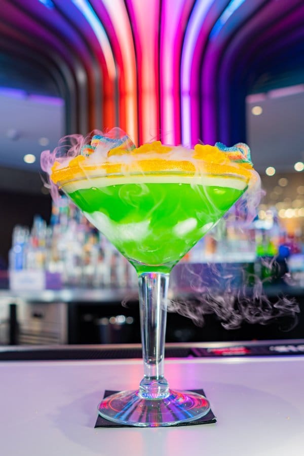 Colorful cocktail with dry ice smoke.