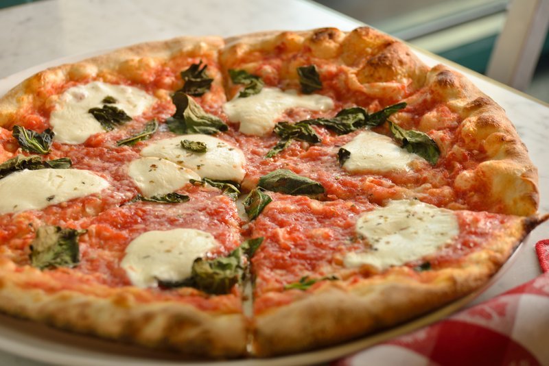 Margherita pizza with basil and mozzarella.