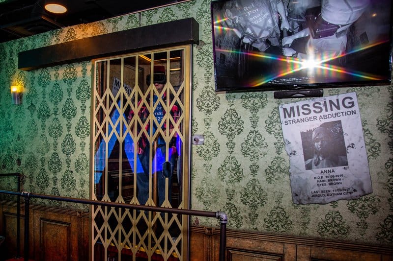 Antique-style elevator with patterned walls.