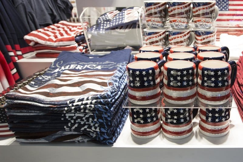American flag themed shirts and mugs on display.