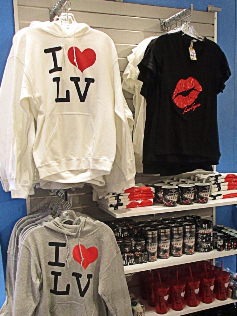Souvenir sweatshirts with "I ❤️ LV" and t-shirt with lips graphic.
