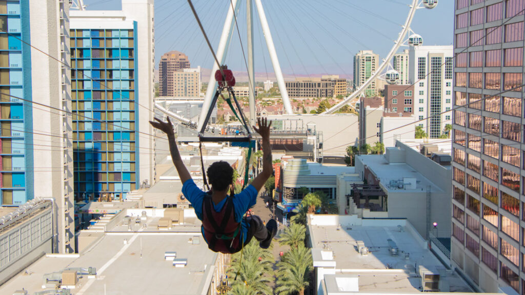 Person ziplining in an urban environment.