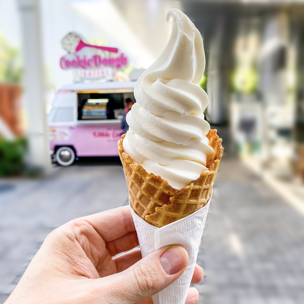 Vanilla soft serve ice cream cone.